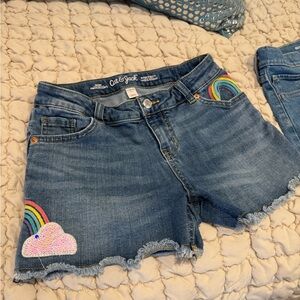 2 Pairs of Girls Blue Denim Shorts. Cat & Jack with Rainbow Design and Old Navy